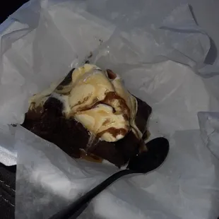 a piece of chocolate cake with ice cream