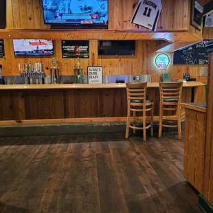 a bar with wood paneling
