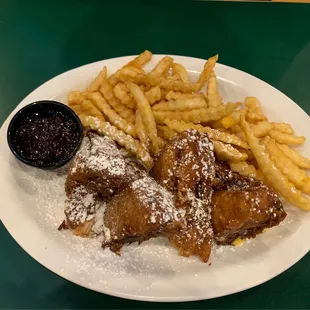 Monte Cristo sandwich! Turkey, ham, American and Swiss! Breaded and deep fried with a dust of powdered sugar and raspberry jam! Yum!