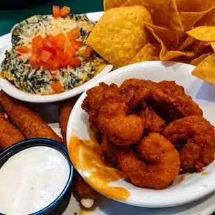 App sampler. Buffalo shrimp, artichoke dip and mozzarella sticks. Yummy!!
