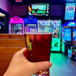 Yuengling Beer with claw machines and racing cars in the back