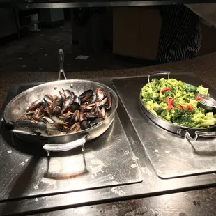 wo pans of food on a table