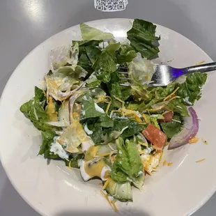 a salad on a white plate