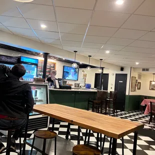 A few tables and the bar I would consider for waiting for your to-go pizza