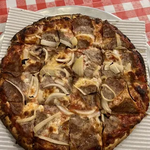 Thin crust sausage and xtra onion.