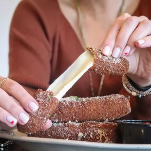 Hand Rolled Mozzarella Sticks Served With Grandma's Red Gravy