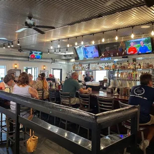 customers sitting at the bar