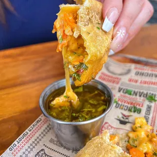 a person holding a piece of bread