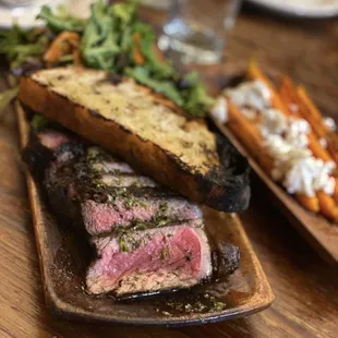 a steak and a side of carrots