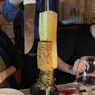 a man pouring a glass of wine