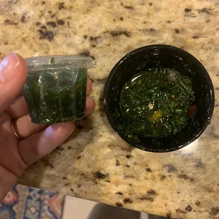 Half filled chimichurri with mini cup.