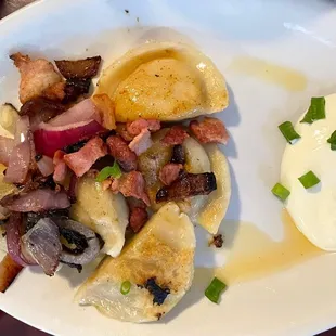 Pierogis and sour cream
