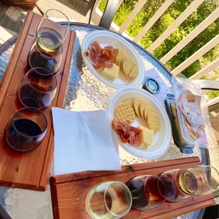 Wine flights, crackers, prosciutto, and cheese