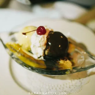 Caramelized Banana Split with Vanilla Ice Cream warm banana bread, butterscotch, chocolate sauce and toasted walnuts
