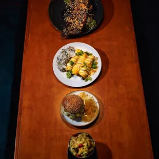 Gax menu items   -Tamarind sticky ribs  -aji de gallina enchiladas  -fire cracker cutlet -poblano mac and cheese