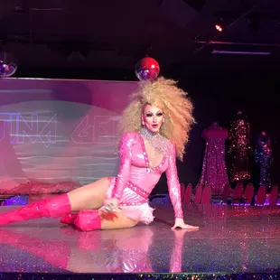 a drag queen in a pink outfit