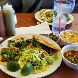 Left-right chorizo, pastor, quesibrria, fish Pico de gallo, rice, consume