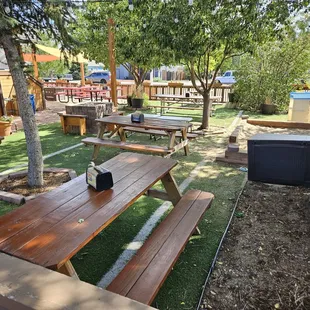 View of patio with sandbox for kids and firepit