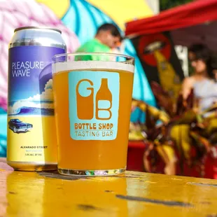 a glass of beer and a can