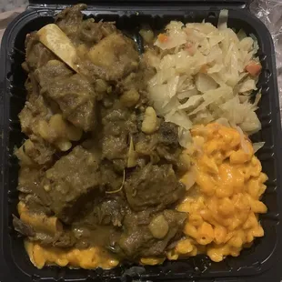 Curry Goat, Mac &amp; Cheese, Steamed Cabbage