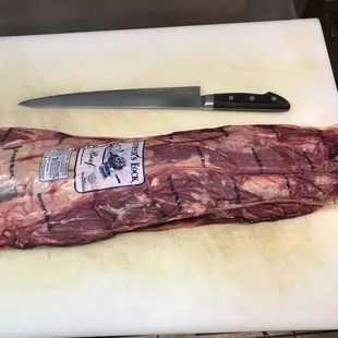a piece of meat on a cutting board