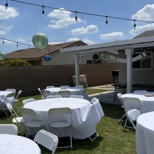 60" round tables with white linen. Each table seats about 8 people per table.