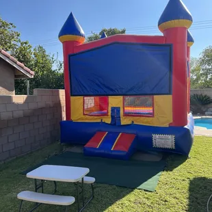 Castle bounce house with toddler picnic table