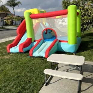 Toddler bouncer with slide and basket ball hoop. One picnic table that seats 4 toddlers comfortably.