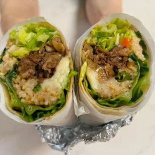 Our BOMB.COM Bulgogi beef Burrito; a perfect combo of savory/sweet. Comes with fried rice, mozzarella cheese, lettuce. Try &amp; you'll love it!