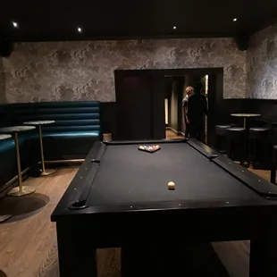 a pool table in a bar