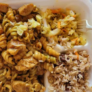 Jerk chicken pasta, rice and beans and steamed cabbage