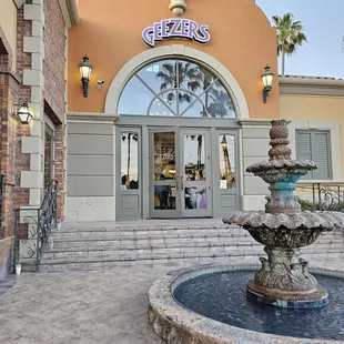 a fountain in front of a building