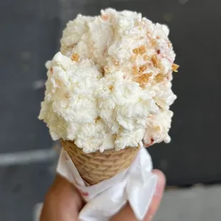 Strawberry Cheesecake (single scoop) in a sugar cone