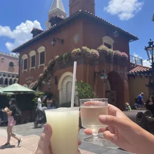 a person holding a glass of gelatera
