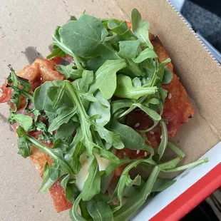 Arabiata slice with arugula