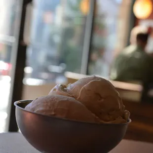 a bowl of ice cream on a table