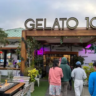 people walking in front of a restaurant