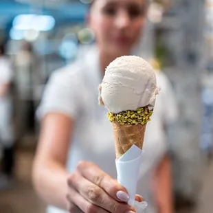 Capriccio con Cono Goloso ($6/piccolo + $2/cone) Hazelnut w/ chocolate spread in a chocolate-pistachio dipped cone