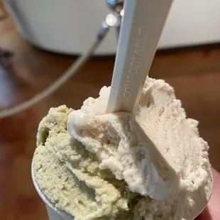 a hand holding a scoop of gelato