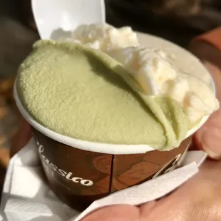 a hand holding a cup