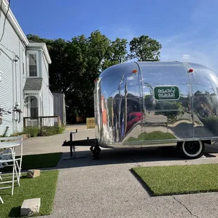 a trailer parked in front of a house