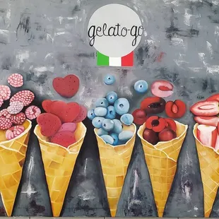 three ice cream cones with different toppings