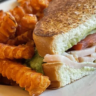 Smoked Turkey club with sweet potato fries