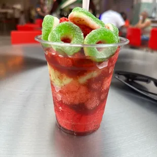 4 scoops, apple rings, Chamoy &amp; tajin.