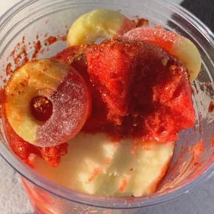 Pineapple &amp; Cherry Gelü with Peach Ring candy toppings.
