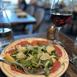 TEXAS WAGYU BEEF CARPACCIO dijonnaise, arugula, parmigiano, pine nuts
