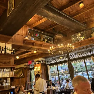people sitting at tables in a restaurant