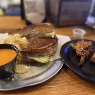 a grilled cheese sandwich with a side of potato chips