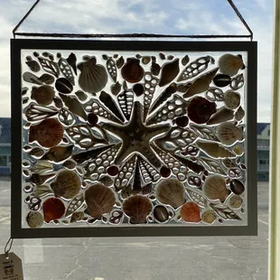 Awesome shell &amp; resin mosaic window art!
