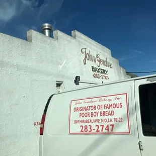 a van parked in front of a building